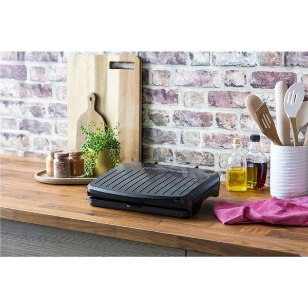 George Foreman Medium Electric Fit Grill [Non stick, Healthy, Griddle, Toastie, Hot plate, Panini, BBQ, Energy saving, Vertical storage, Easy clean, Drip tray, Ready to cook light] Black, 1630W 25810