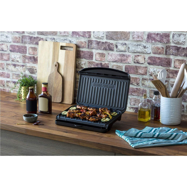 George Foreman Medium Electric Fit Grill [Non stick, Healthy, Griddle, Toastie, Hot plate, Panini, BBQ, Energy saving, Vertical storage, Easy clean, Drip tray, Ready to cook light] Black, 1630W 25810